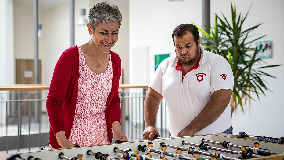 Volunteer at the table football table Volunteer at the table football table
